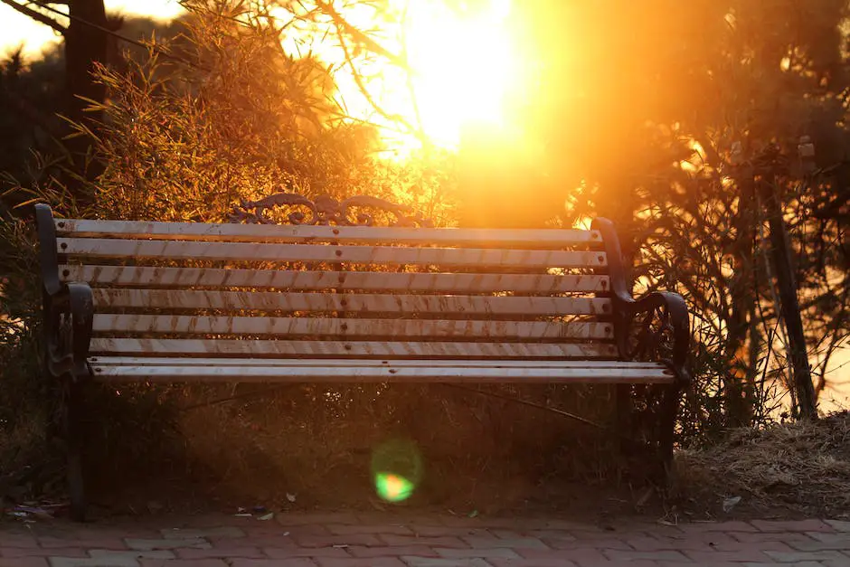 A picture showing a person sitting alone on a bench, with their head tilted down and hands clasped in front of them, representing the emotional struggle of grief.