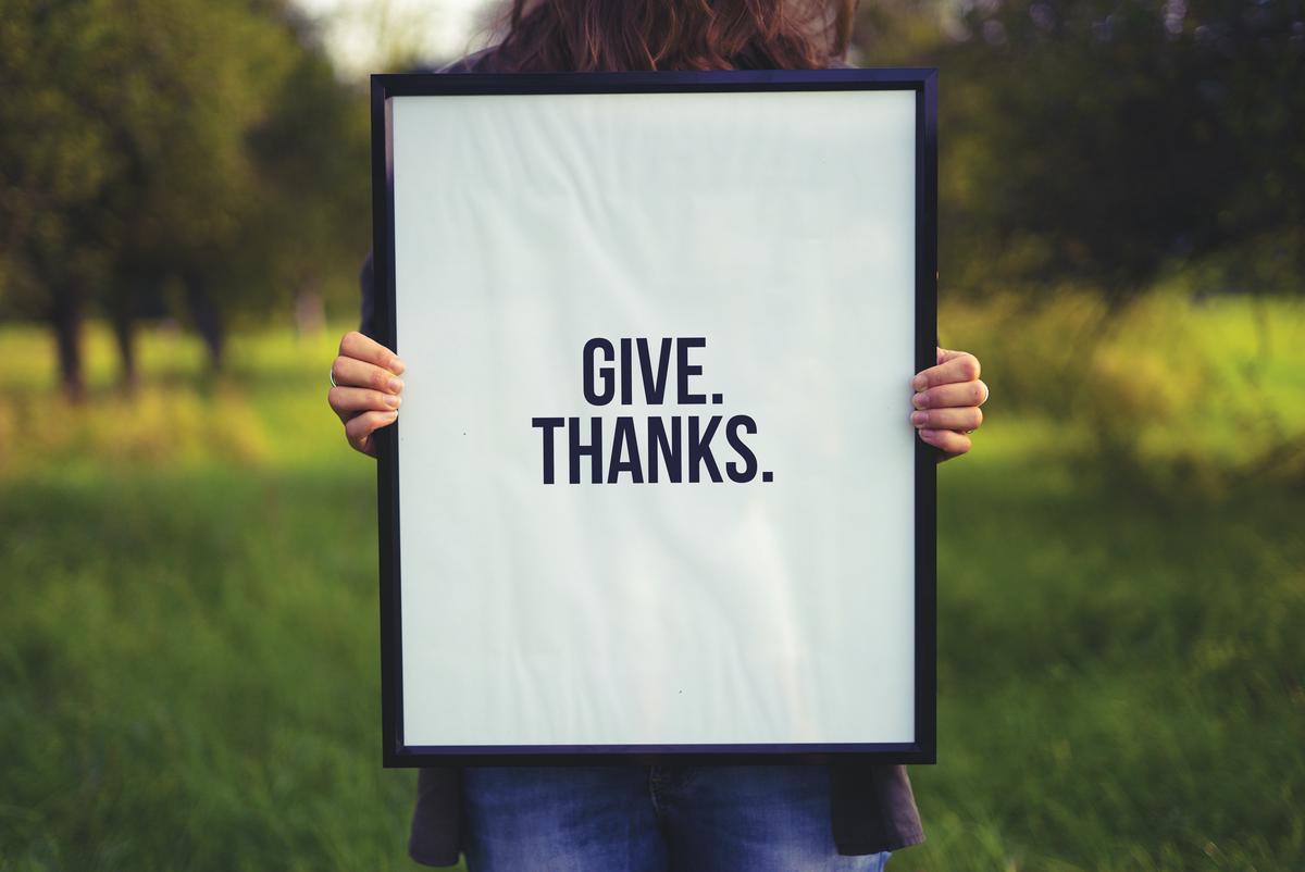 Image depicting a person showing gratitude and feeling confident.